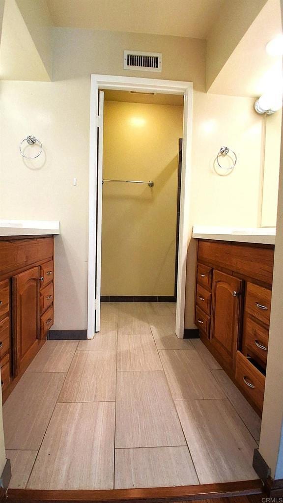 5312 Caminito Cachorro, San Diego, CA 92105 - bathroom with vanity and wood finished floors