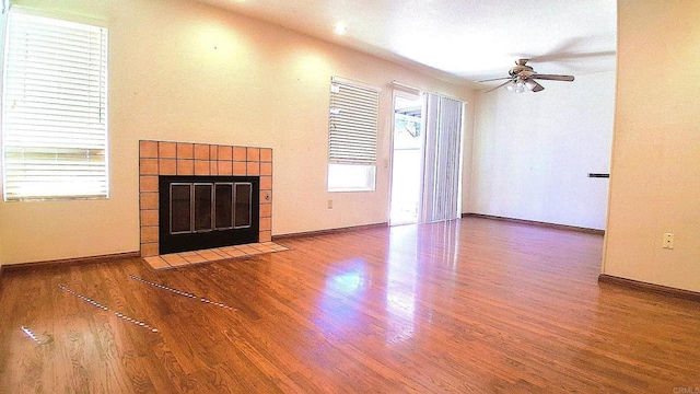 5312 Caminito Cachorro, San Diego, CA 92105 - unfurnished living room with a tile fireplace, ceiling fan, and wood finished floors