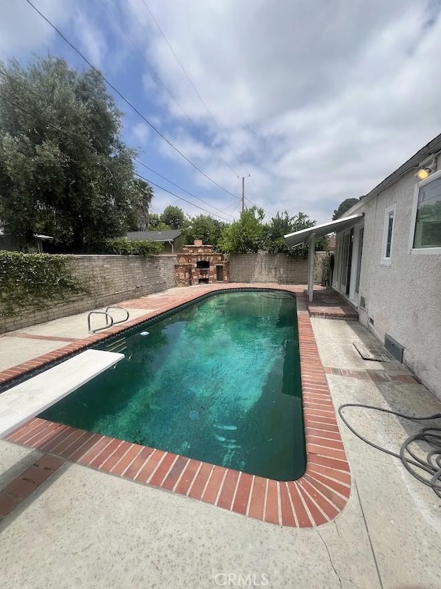 717 N Valley St, Toluca Lake, CA 91505 - view of pool featuring a patio area, a fenced backyard, and a diving board