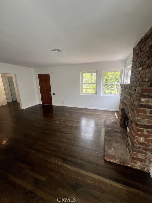 717 N Valley St, Toluca Lake, CA 91505 - unfurnished living room featuring wood finished floors and a fireplace