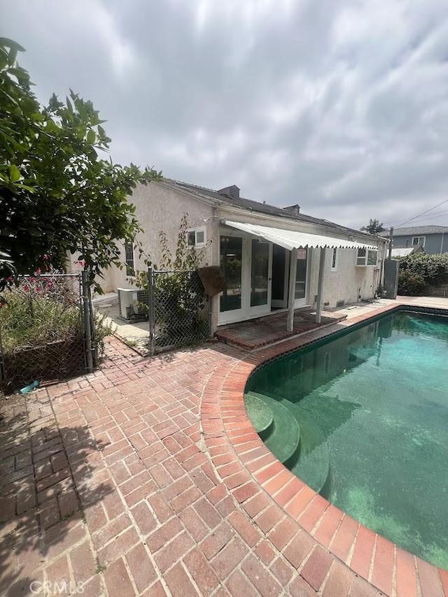 717 N Valley St, Toluca Lake, CA 91505 - view of swimming pool featuring a patio area and french doors