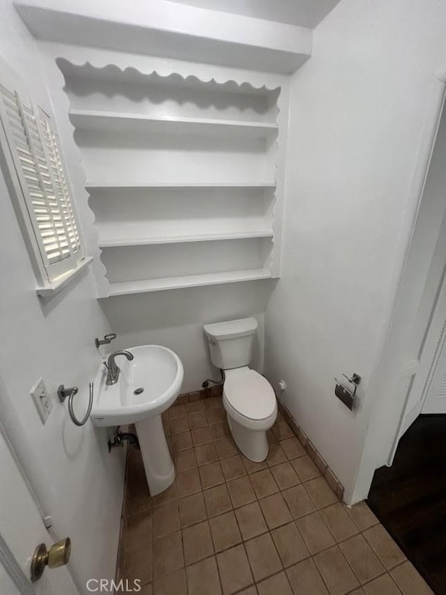 717 N Valley St, Toluca Lake, CA 91505 - half bath with tile patterned floors and toilet