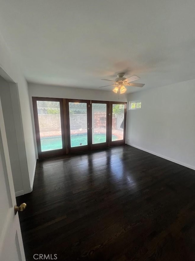 717 N Valley St, Toluca Lake, CA 91505 - unfurnished room with a ceiling fan, dark wood-type flooring, and plenty of natural light