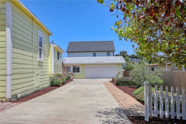 128 N Mason St, Arroyo Grande, CA 93420 - traditional-style home with concrete driveway, a garage, and an outdoor structure