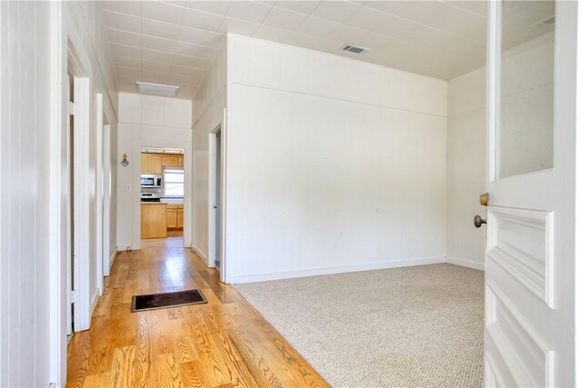 128 N Mason St, Arroyo Grande, CA 93420 - hallway featuring light wood-style floors and baseboards