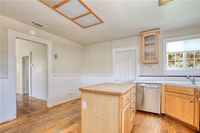 128 N Mason St, Arroyo Grande, CA 93420 - kitchen featuring dishwasher, light wood-style floors, a wainscoted wall, glass insert cabinets, and light brown cabinetry