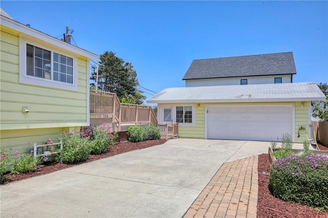 128 N Mason St, Arroyo Grande, CA 93420 - view of front of property featuring driveway, a garage, and roof with shingles