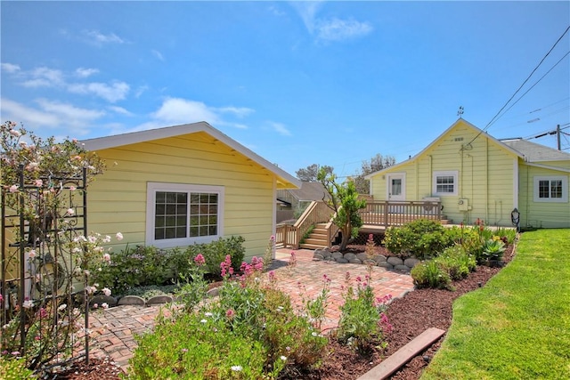 128 N Mason St, Arroyo Grande, CA 93420 - back of property with a patio, a wooden deck, and a yard