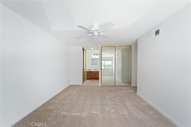 17430 Plaza Otonal, San Diego, CA 92128 - unfurnished bedroom with light carpet, a closet, ensuite bathroom, and a ceiling fan