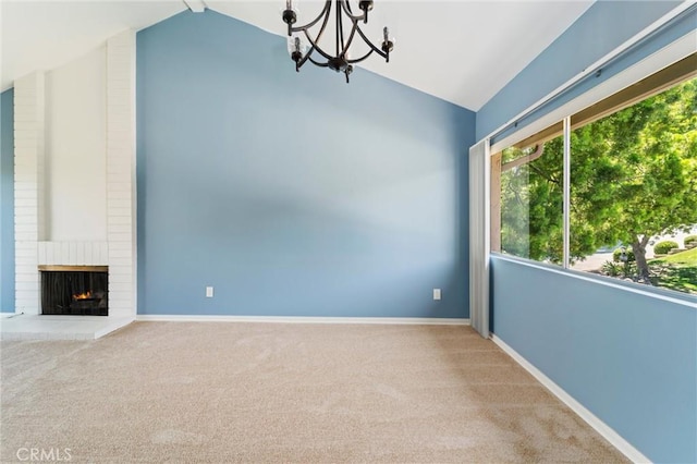 17430 Plaza Otonal, San Diego, CA 92128 - unfurnished living room featuring vaulted ceiling, a chandelier, carpet flooring, and a brick fireplace