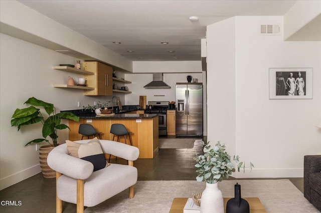 5232 Satsuma Ave Unit 106, North Hollywood, CA 91601 - kitchen with appliances with stainless steel finishes, wall chimney range hood, open shelves, a peninsula, and dark countertops