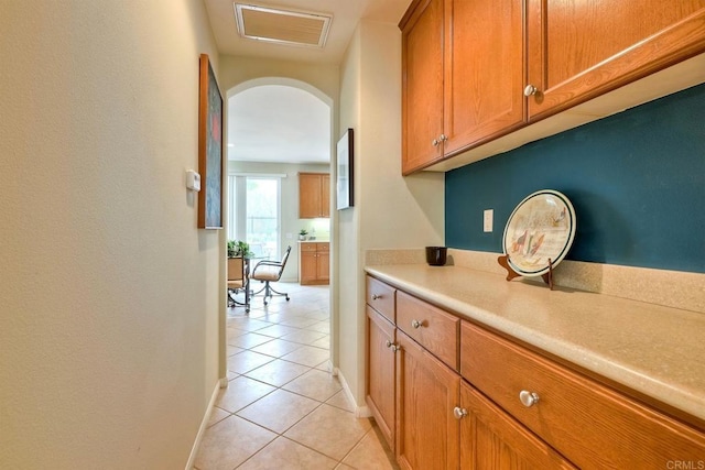 118 Double Eagle, Escondido, CA 92026 - corridor featuring light tile patterned floors and arched walkways