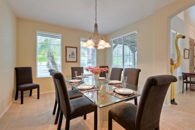 118 Double Eagle, Escondido, CA 92026 - dining room with a chandelier, plenty of natural light, arched walkways, and light carpet