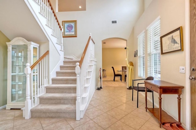 118 Double Eagle, Escondido, CA 92026 - stairway featuring arched walkways, tile patterned flooring, and a high ceiling