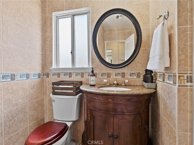 334 N Lomita St, Burbank, CA 91506 - bathroom with tile walls, vanity, and decorative backsplash