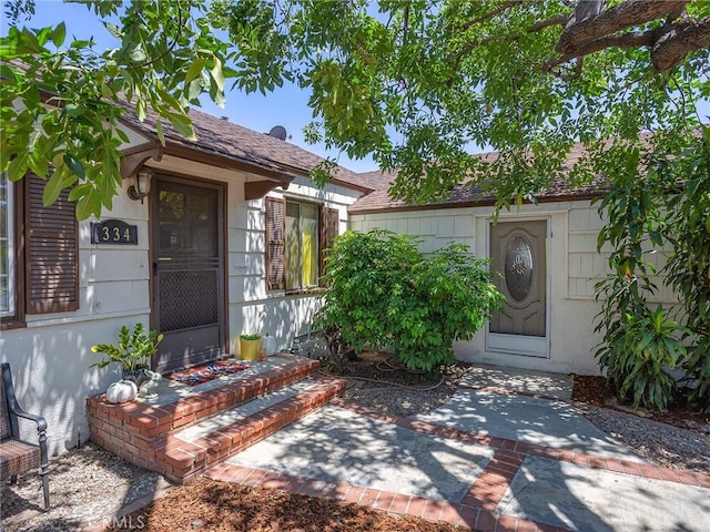 334 N Lomita St, Burbank, CA 91506 - doorway to property with a shingled roof and a patio area