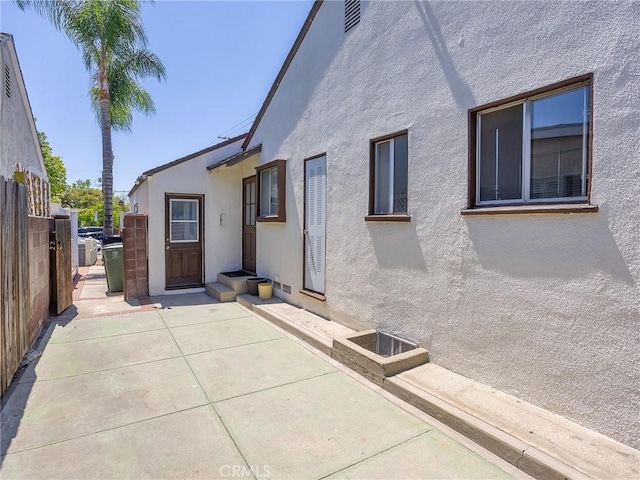 334 N Lomita St, Burbank, CA 91506 - rear view of house featuring stucco siding and a patio