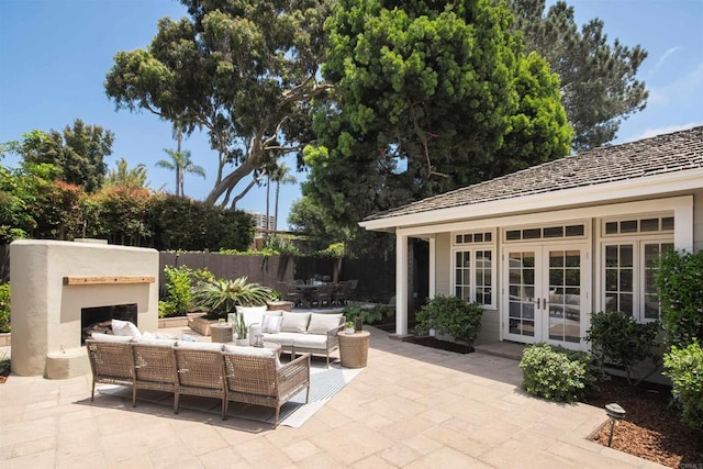 8031 La Jolla Shores Dr, La Jolla, CA 92037 - view of patio / terrace featuring french doors and an outdoor living space with a fireplace