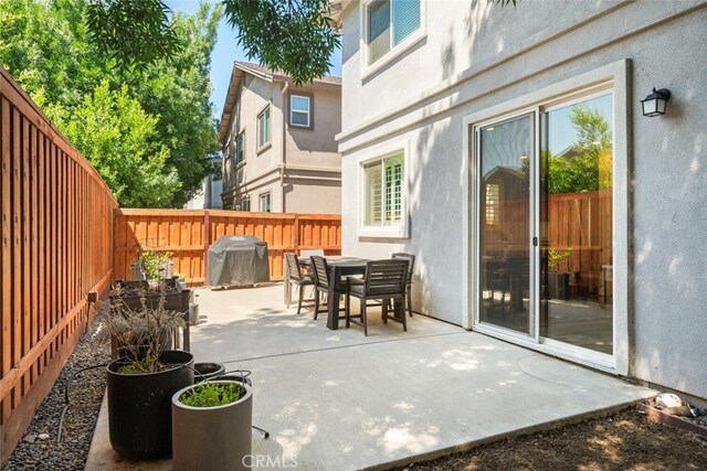 27 Bentwater Loop, Chico, CA 95973 - fenced backyard with grilling area, a patio, and outdoor dining space