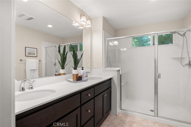 27 Bentwater Loop, Chico, CA 95973 - bathroom featuring double vanity, a stall shower, and tile patterned floors
