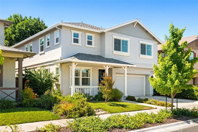 27 Bentwater Loop, Chico, CA 95973 - view of front facade featuring covered porch, an attached garage, stucco siding, and roof with shingles