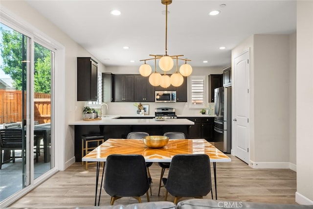 27 Bentwater Loop, Chico, CA 95973 - dining room featuring healthy amount of natural light, light wood-style flooring, and recessed lighting