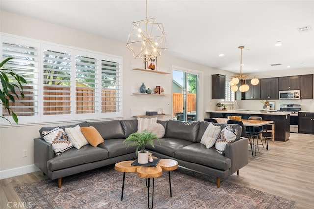 27 Bentwater Loop, Chico, CA 95973 - living room with a chandelier, light wood finished floors, and recessed lighting