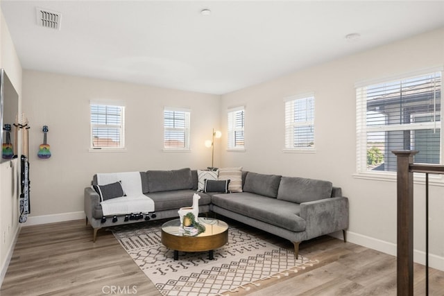 27 Bentwater Loop, Chico, CA 95973 - living room with plenty of natural light and light wood-style floors