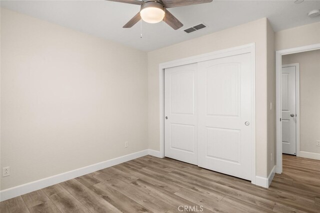 27 Bentwater Loop, Chico, CA 95973 - unfurnished bedroom with wood finished floors, a closet, and a ceiling fan