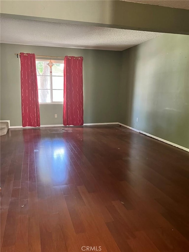 18 Fairside Unit 30, Irvine, CA 92614 - empty room with a textured ceiling and wood-type flooring