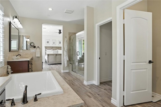29 Lucido St, Rancho Mission Viejo, CA 92694 - full bath featuring vanity, a shower stall, a bath, wood finished floors, and recessed lighting