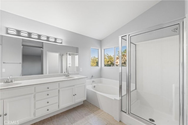 2892 Chuckwagon Rd, Palmdale, CA 93550 - full bathroom featuring vaulted ceiling, double vanity, a garden tub, a stall shower, and tile patterned flooring