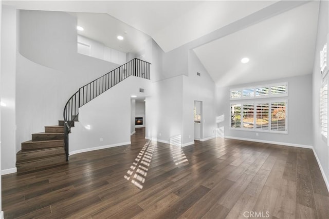 2892 Chuckwagon Rd, Palmdale, CA 93550 - unfurnished living room with stairway, wood finished floors, high vaulted ceiling, and recessed lighting