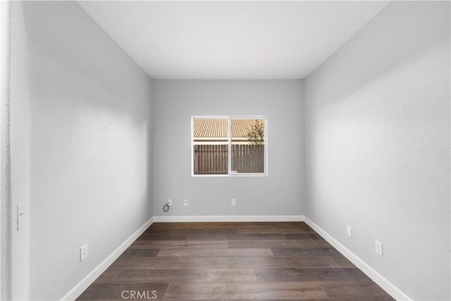 2892 Chuckwagon Rd, Palmdale, CA 93550 - unfurnished room with dark wood-style flooring and baseboards