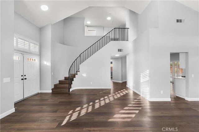 2892 Chuckwagon Rd, Palmdale, CA 93550 - entrance foyer with high vaulted ceiling, stairs, and wood finished floors