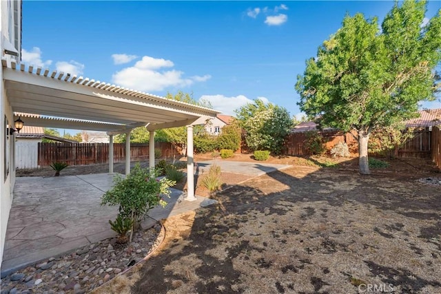 2892 Chuckwagon Rd, Palmdale, CA 93550 - fenced backyard with a patio area and a pergola