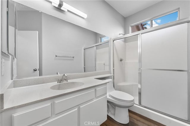 2892 Chuckwagon Rd, Palmdale, CA 93550 - bathroom featuring a shower stall, wood finished floors, and vanity