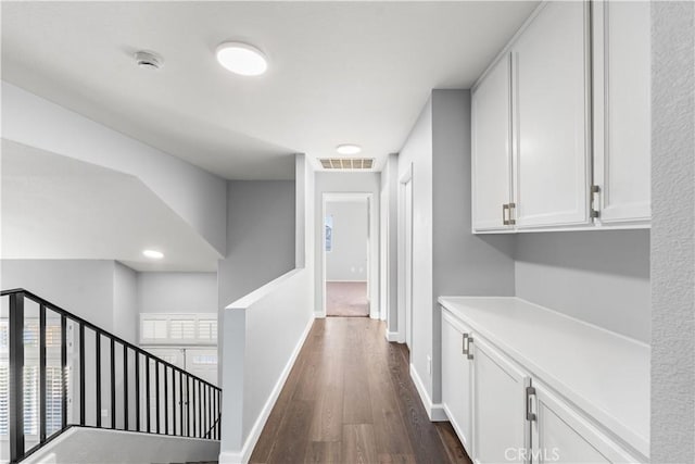 2892 Chuckwagon Rd, Palmdale, CA 93550 - corridor featuring dark wood-type flooring and baseboards