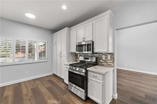 2892 Chuckwagon Rd, Palmdale, CA 93550 - kitchen featuring stainless steel appliances, light countertops, decorative backsplash, white cabinets, and recessed lighting