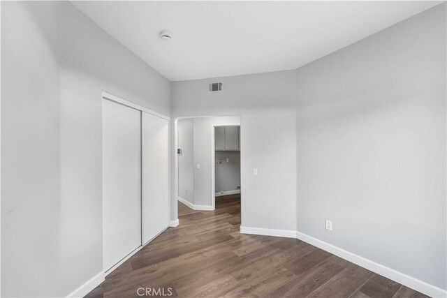 2892 Chuckwagon Rd, Palmdale, CA 93550 - unfurnished bedroom featuring wood finished floors and a closet