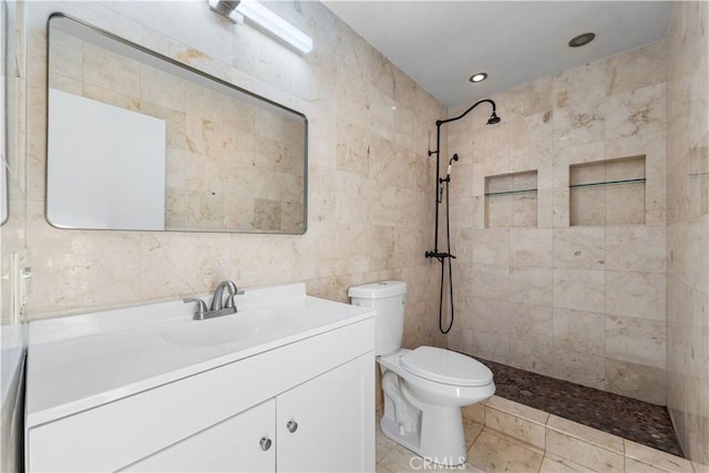 2892 Chuckwagon Rd, Palmdale, CA 93550 - bathroom with tile walls, tiled shower, vanity, and recessed lighting