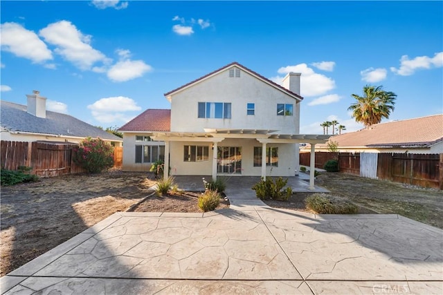 2892 Chuckwagon Rd, Palmdale, CA 93550 - rear view of property featuring a pergola, a patio area, stucco siding, and a fenced backyard