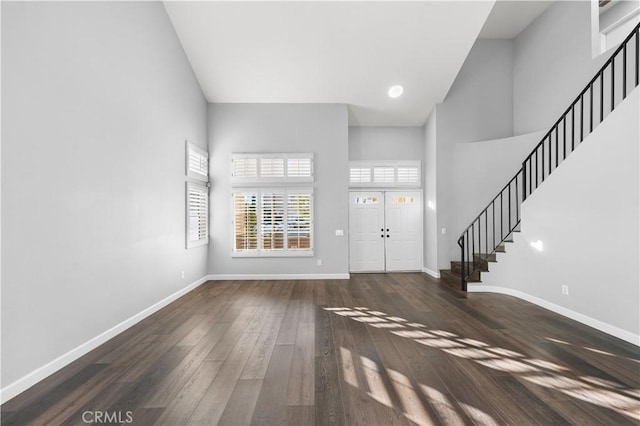 2892 Chuckwagon Rd, Palmdale, CA 93550 - foyer entrance featuring high vaulted ceiling, stairs, and wood finished floors