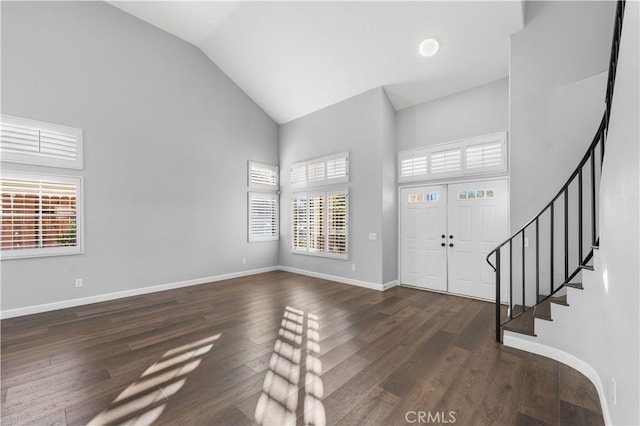 2892 Chuckwagon Rd, Palmdale, CA 93550 - foyer with high vaulted ceiling, stairway, and dark wood-style flooring