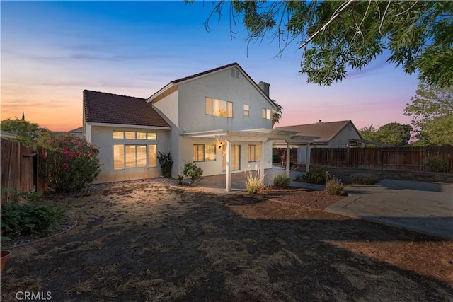 2892 Chuckwagon Rd, Palmdale, CA 93550 - back of house with a pergola, a patio, a fenced backyard, stucco siding, and a tiled roof