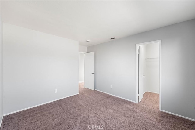 2892 Chuckwagon Rd, Palmdale, CA 93550 - unfurnished bedroom with carpet flooring, a walk in closet, and a closet