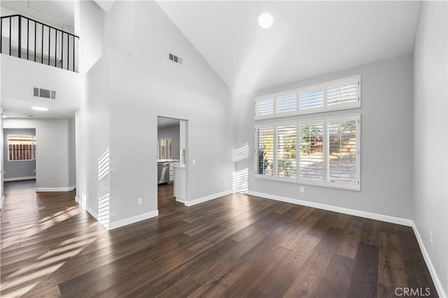 2892 Chuckwagon Rd, Palmdale, CA 93550 - unfurnished living room featuring wood finished floors and high vaulted ceiling