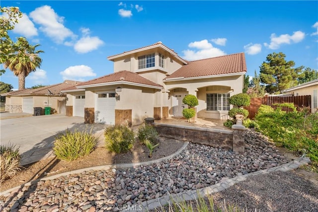2892 Chuckwagon Rd, Palmdale, CA 93550 - view of front of house with stucco siding, driveway, a garage, and a tile roof