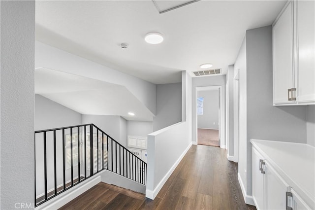 2892 Chuckwagon Rd, Palmdale, CA 93550 - corridor with an upstairs landing and dark wood-style flooring