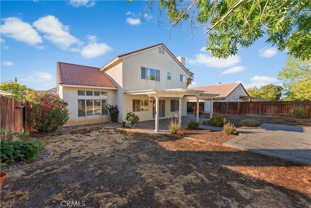 2892 Chuckwagon Rd, Palmdale, CA 93550 - rear view of house featuring a pergola, a fenced backyard, a tile roof, and a patio area